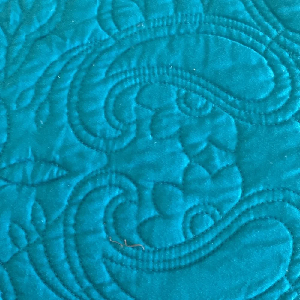 In excellent condition size Queen quilt.